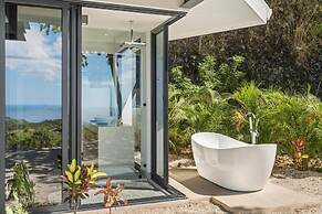 Luxurious Ultramodern Property with Private Suites, Infinity Pool, and