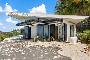 Luxurious Ultramodern Property with Private Suites, Infinity Pool, and