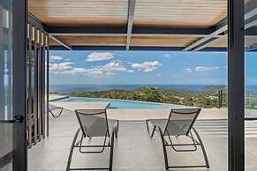 Luxurious Ultramodern Property with Private Suites, Infinity Pool, and
