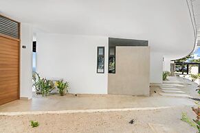 Luxurious Ultramodern Property with Private Suites, Infinity Pool, and