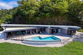 Luxurious Ultramodern Property with Private Suites, Infinity Pool, and