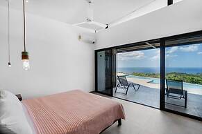 Luxurious Ultramodern Property with Private Suites, Infinity Pool, and