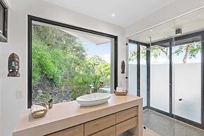 Luxurious Ultramodern Property with Private Suites, Infinity Pool, and