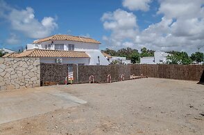 Apartamentos piscina compartida