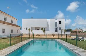 Apartamentos piscina compartida