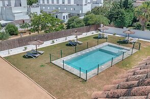 Apartamentos piscina compartida
