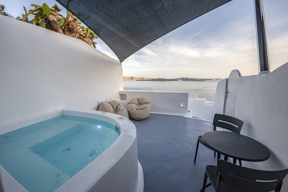 Three Domes Oia - an Iconic Collection