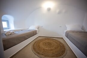 Three Domes Oia - an Iconic Collection