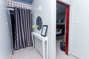 The Den Soroti White