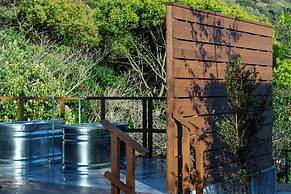 amarancia cottage hugging nature house