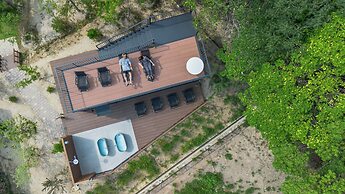 amarancia cottage hugging nature house