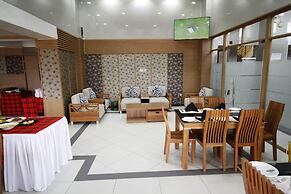 WE Hotel and Suites