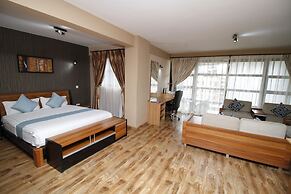 WE Hotel and Suites