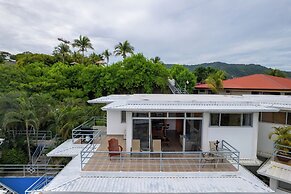 Modern Top-Floor Condo with Panoramic Views and Community Pool