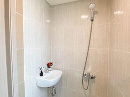 Warm Minimalist Studio Apartment Near Paramadina University At Meikart