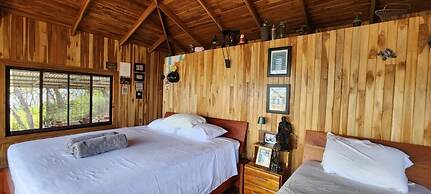 Teak House in a Forest Above the Beach