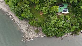 Teak House in a Forest Above the Beach
