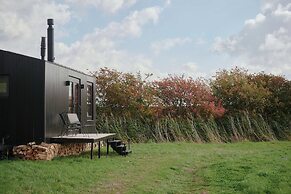 Raus | Cabins mit Feldblick + Saunazugang