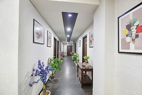 Fabhotel Happy Residency