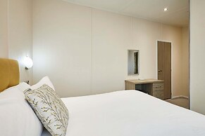 Host Stay Woodpecker Lodge