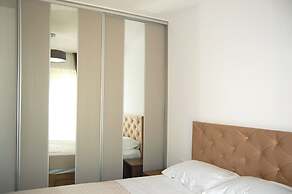 Status Apartments 100