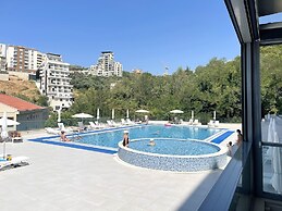 Status Apartments 100