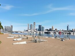 2BR Beachfront Retreat with Palm Views