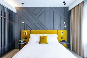 MH SUITES PLEBISCITO