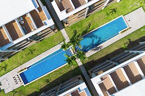 Stylish 1BR Apartment – Pool Access, Close to Beach