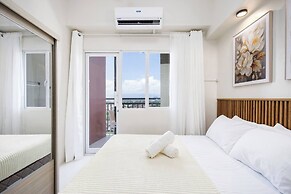 Elegant Wood-accent Studio With Balcony