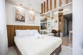 Elegant Wood-accent Studio With Balcony
