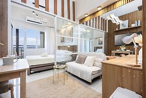 Elegant Wood-accent Studio With Balcony