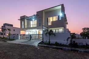 ELIVAAS White House 4BHK Villa With Pool