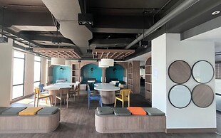 Blue Accent Studio At Delft Ciputra Makassar Apartment