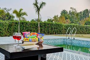 ELIVAAS Amaltas 4BHK Hideaway With Pool