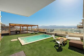 Sunny Rooftop Poolside Panoramic View