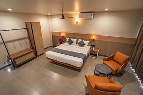 Aura Inn & Suites