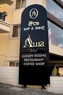 Aura Inn & Suites