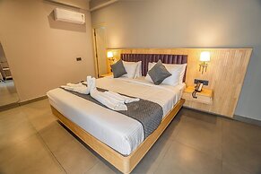 Aura Inn & Suites