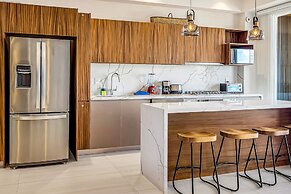 Modern Waterfront Condo With Shared Pool, Balcony, and Washer/dryer