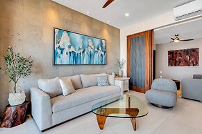 Modern Waterfront Condo With Shared Pool, Balcony, and Washer/dryer