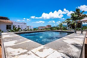 Modern Waterfront Condo With Shared Pool, Balcony, and Washer/dryer
