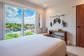 Modern Waterfront Condo With Shared Pool, Balcony, and Washer/dryer