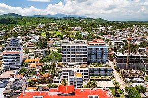 Modern Waterfront Condo With Shared Pool, Balcony, and Washer/dryer