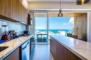 Modern Waterfront Condo With Shared Pool, Balcony, and Washer/dryer