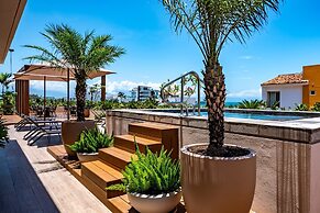 Modern Waterfront Condo With Shared Pool, Balcony, and Washer/dryer