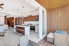 Modern Waterfront Condo With Shared Pool, Balcony, and Washer/dryer