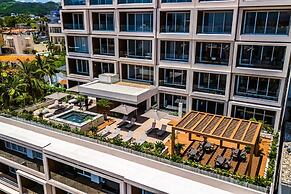 Modern Waterfront Condo With Shared Pool, Balcony, and Washer/dryer