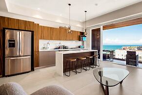 Modern Waterfront Condo With Shared Pool, Balcony, and Washer/dryer