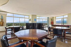 Chic Coastal Condo With Private Balcony, Pool Access & Steps to the Be